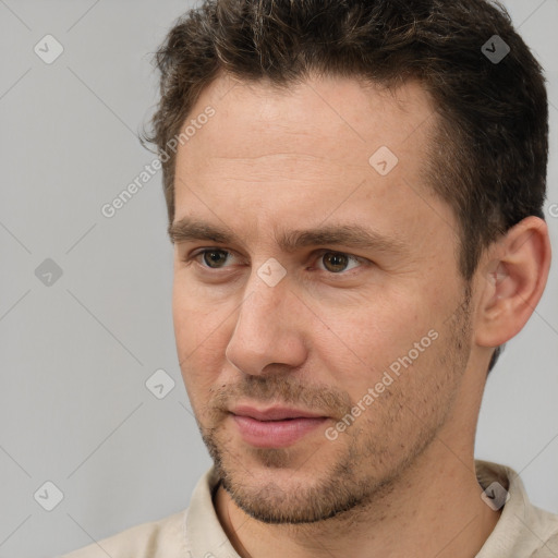 Joyful white adult male with short  brown hair and brown eyes