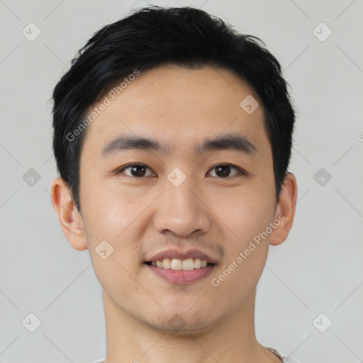 Joyful asian young-adult male with short  black hair and brown eyes