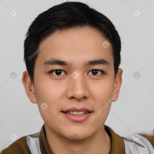 Joyful asian young-adult male with short  brown hair and brown eyes