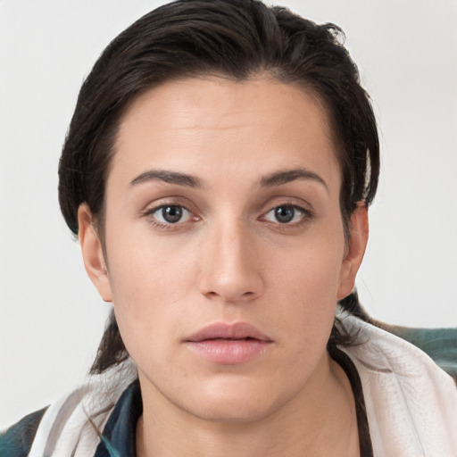 Neutral white young-adult female with medium  brown hair and brown eyes