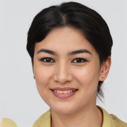 Joyful asian young-adult female with short  brown hair and brown eyes