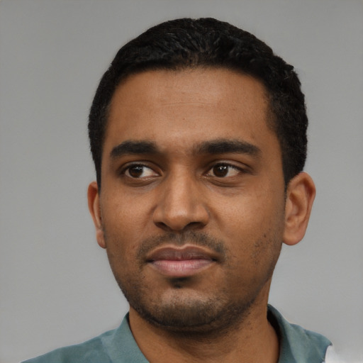 Neutral black young-adult male with short  black hair and brown eyes