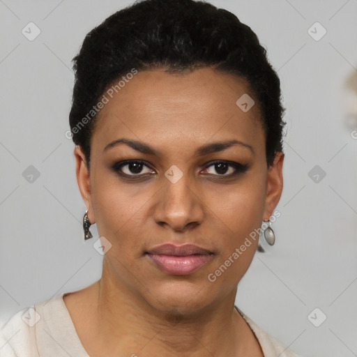 Joyful black young-adult female with short  black hair and brown eyes