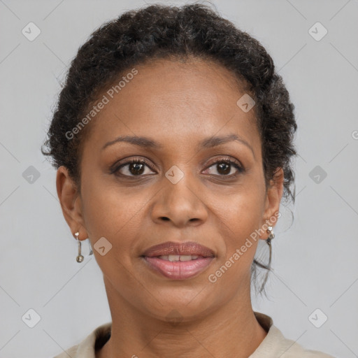 Joyful black adult female with short  brown hair and brown eyes