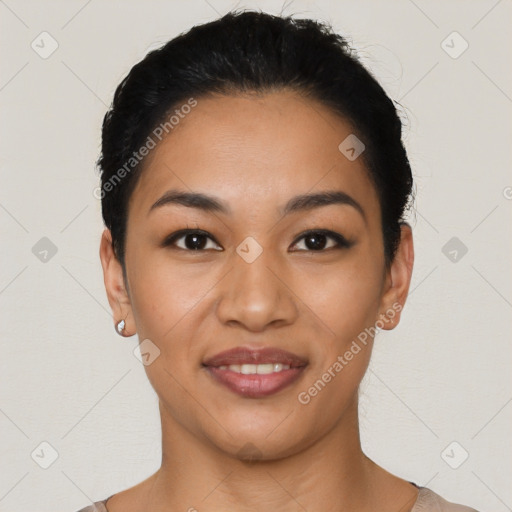 Joyful latino young-adult female with short  black hair and brown eyes