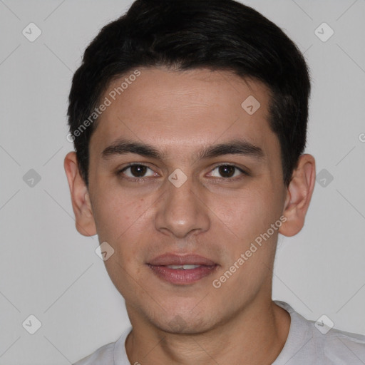 Joyful white young-adult male with short  black hair and brown eyes