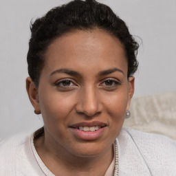 Joyful white young-adult female with short  brown hair and brown eyes