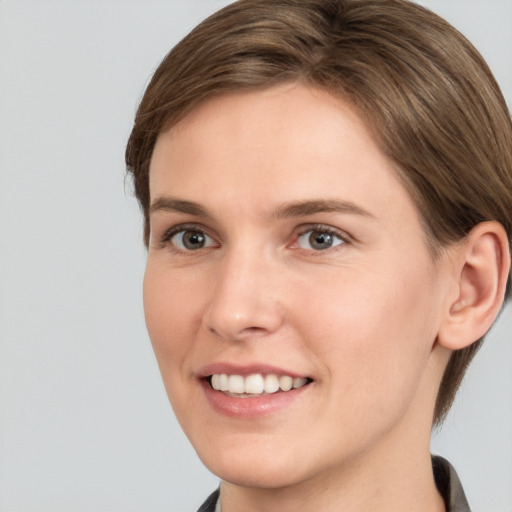 Joyful white young-adult female with short  brown hair and brown eyes