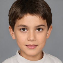 Joyful white child male with short  brown hair and brown eyes