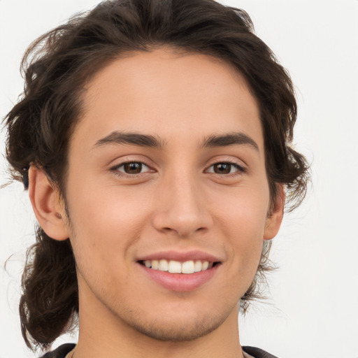 Joyful white young-adult male with medium  brown hair and brown eyes