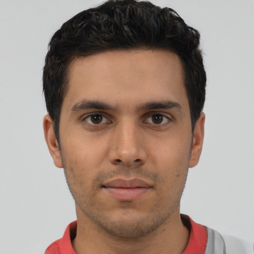Neutral latino young-adult male with short  brown hair and brown eyes