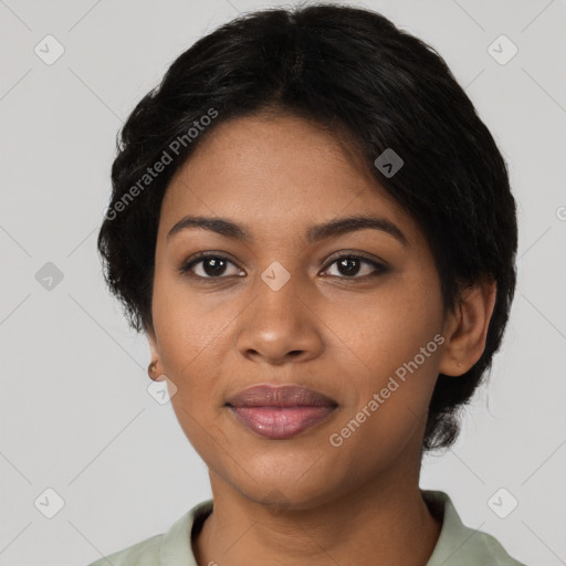 Joyful black young-adult female with short  black hair and brown eyes