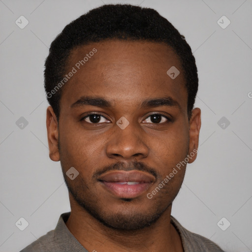 Joyful latino young-adult male with short  brown hair and brown eyes