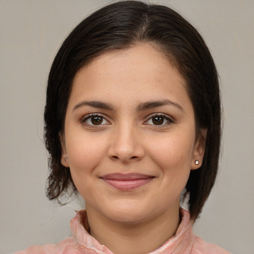 Joyful white young-adult female with medium  brown hair and brown eyes