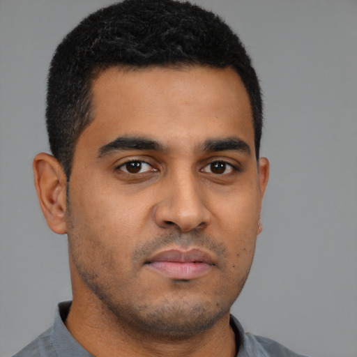 Neutral latino young-adult male with short  brown hair and brown eyes