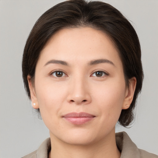 Joyful white young-adult female with medium  brown hair and brown eyes