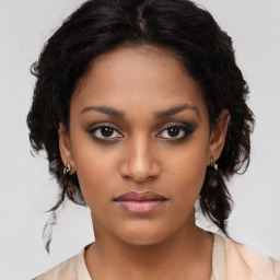 Neutral black young-adult female with medium  brown hair and brown eyes