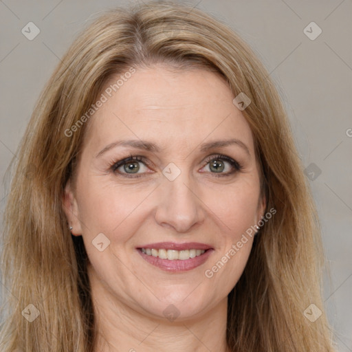 Joyful white adult female with long  brown hair and brown eyes