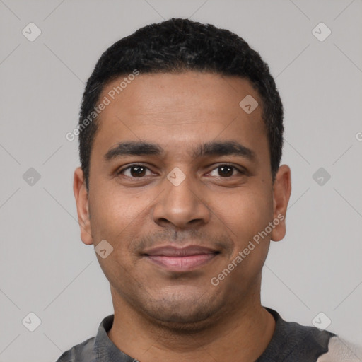 Joyful latino young-adult male with short  black hair and brown eyes