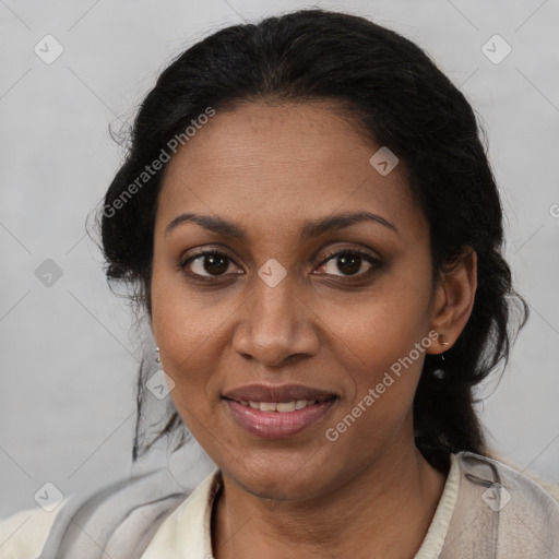 Joyful black adult female with medium  brown hair and brown eyes