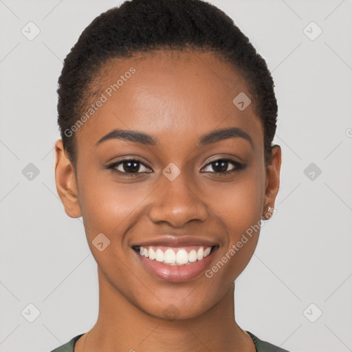 Joyful black young-adult female with short  brown hair and brown eyes