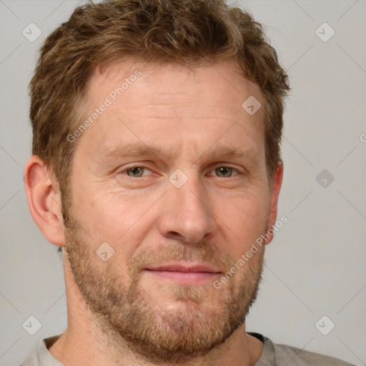 Joyful white adult male with short  brown hair and grey eyes