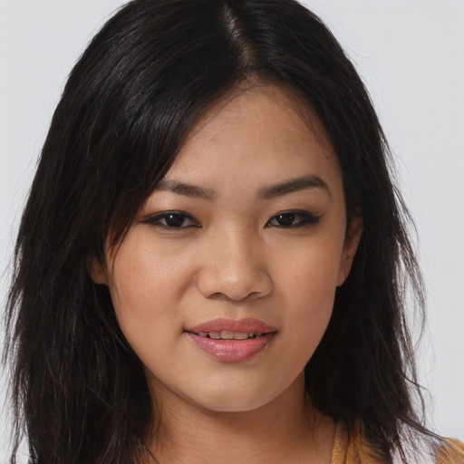 Joyful asian young-adult female with long  brown hair and brown eyes