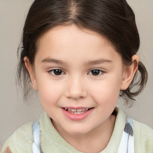 Joyful white child female with medium  brown hair and brown eyes