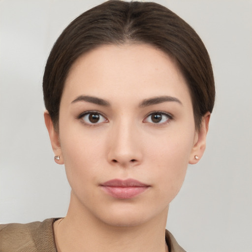 Neutral white young-adult female with short  brown hair and brown eyes