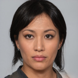 Neutral asian young-adult female with medium  black hair and brown eyes