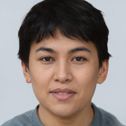 Joyful asian young-adult female with short  black hair and brown eyes