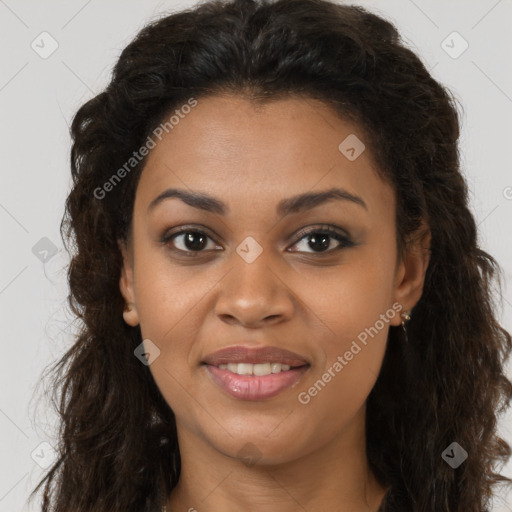 Joyful black young-adult female with long  brown hair and brown eyes