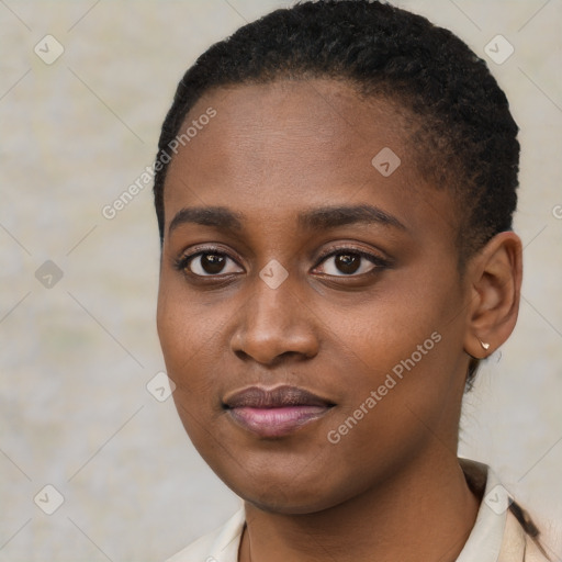 Joyful black young-adult female with short  brown hair and brown eyes