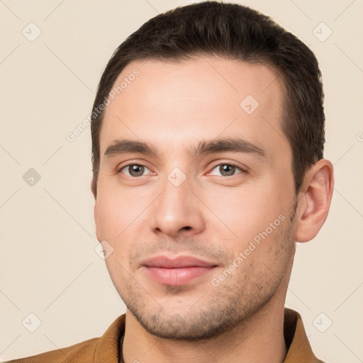 Joyful white young-adult male with short  brown hair and brown eyes