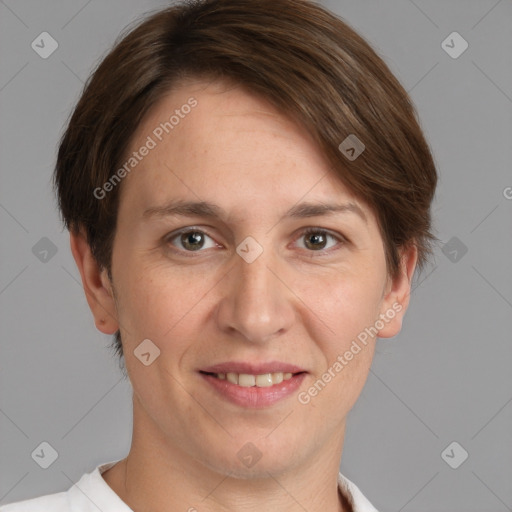 Joyful white adult female with short  brown hair and grey eyes