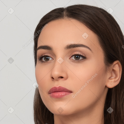 Neutral white young-adult female with long  brown hair and brown eyes