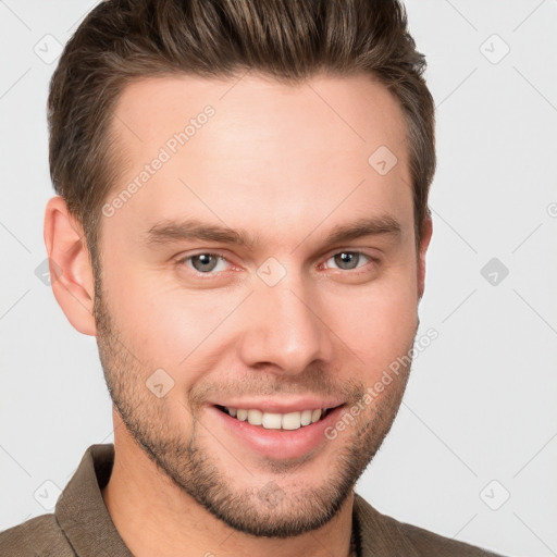 Joyful white young-adult male with short  brown hair and grey eyes