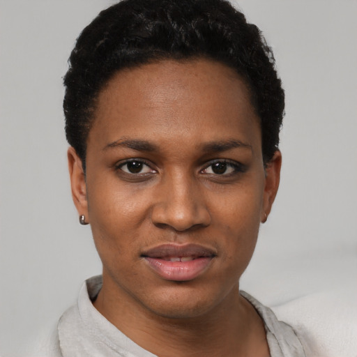 Joyful latino young-adult female with short  black hair and brown eyes