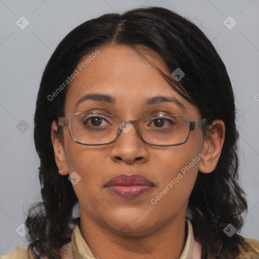 Joyful black adult female with medium  brown hair and brown eyes