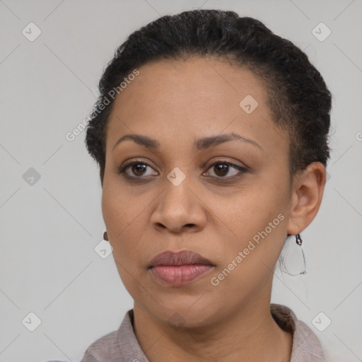 Joyful black adult female with short  brown hair and brown eyes