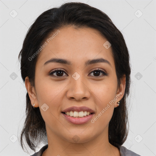 Joyful latino young-adult female with medium  brown hair and brown eyes