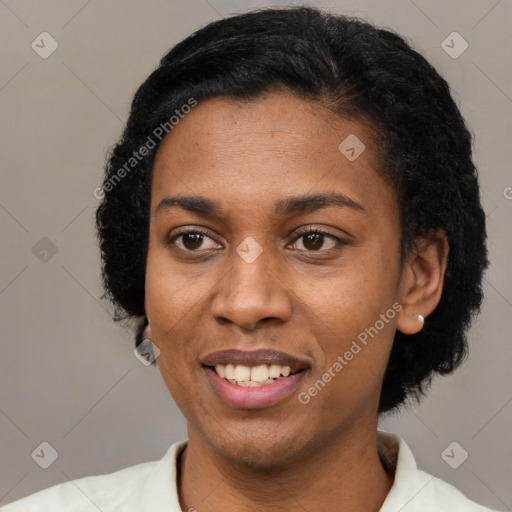 Joyful black adult female with short  black hair and brown eyes