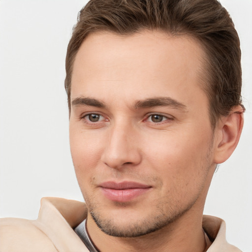 Joyful white young-adult male with short  brown hair and brown eyes