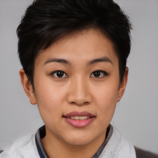 Joyful asian young-adult female with short  brown hair and brown eyes