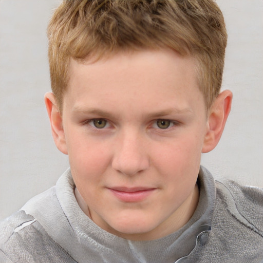 Joyful white child male with short  brown hair and grey eyes