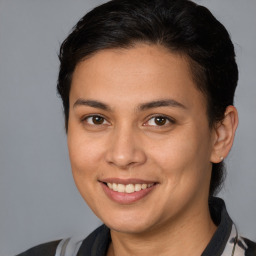 Joyful white young-adult female with medium  brown hair and brown eyes