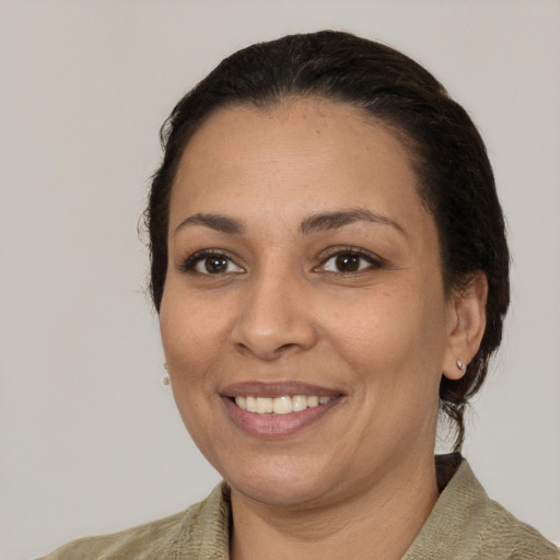 Joyful white adult female with medium  brown hair and brown eyes