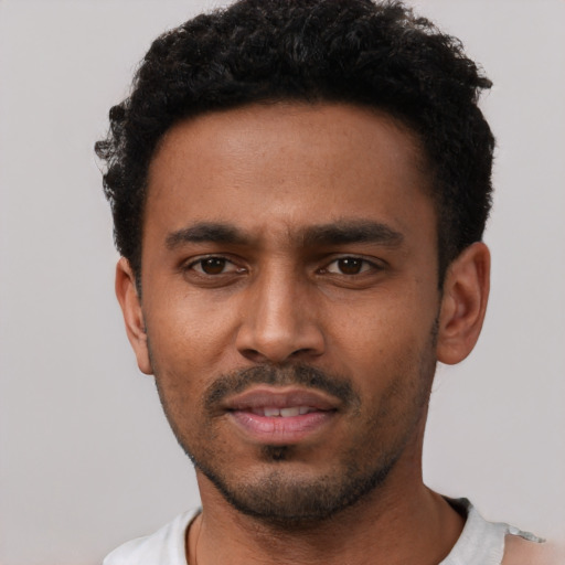 Neutral black young-adult male with short  black hair and brown eyes