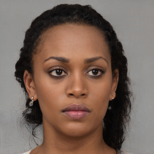 Neutral black young-adult female with long  brown hair and brown eyes