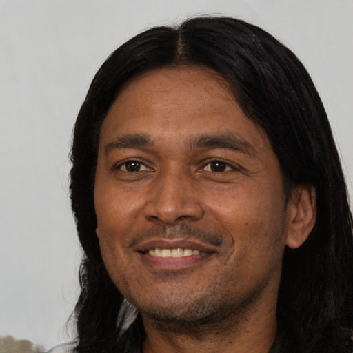Joyful asian adult male with short  black hair and brown eyes
